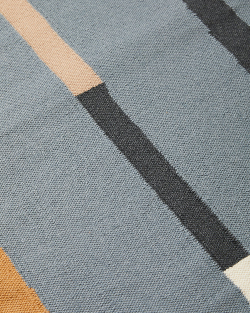 close-up of ethically handwoven flat weave MINNA Lines Rug in Dusk, dusty blue