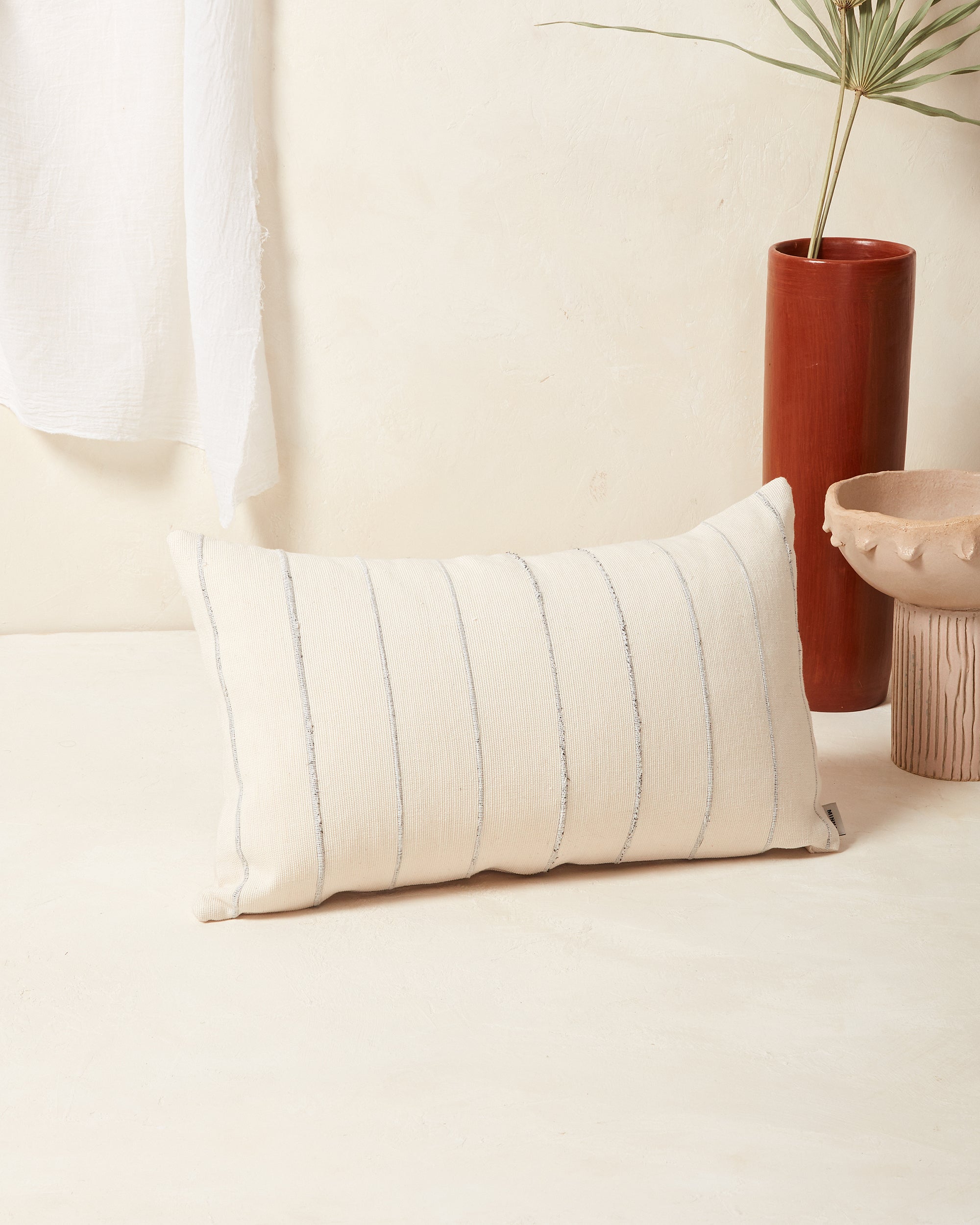 Ethically handwoven recycled stripe decorative throw pillow by MINNA in cream and grey.