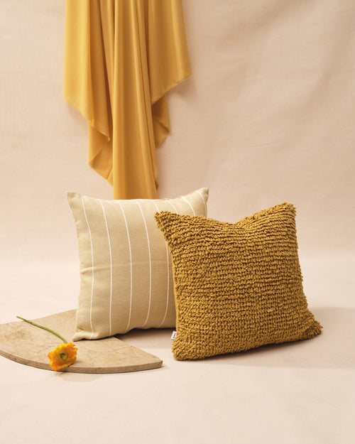Two ethically handmade decorative throw pillows in goldenrod, yellow, ochre, lemon. 