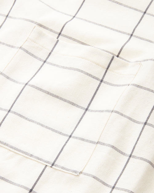 MINNA ethically handwoven 100% cotton apron with cream grid pattern