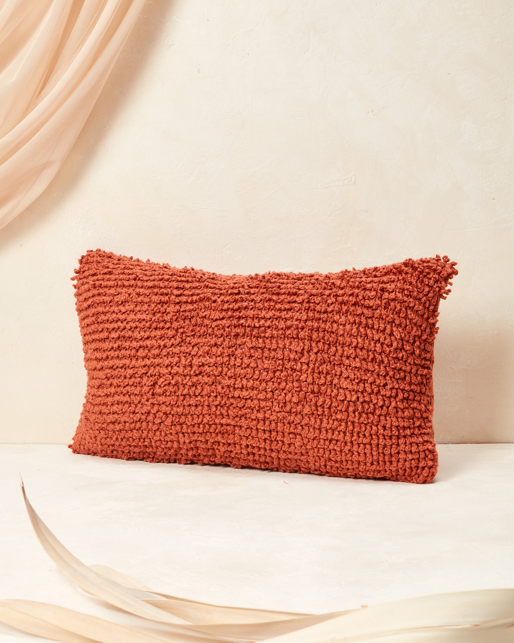 Ethically handmade hand knit decorative throw pillow. The MINNA Cloud Pillow in Persimmon, 100% GOTS-certified cotton textural throw pillow.