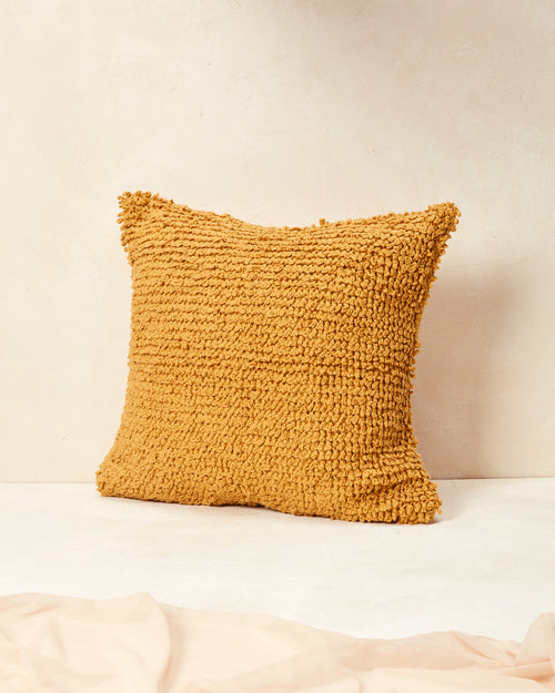 Ethically handmade hand knit decorative throw pillow. The MINNA Cloud Pillow in Goldenrod, 100% GOTS-certified cotton textural throw pillow.