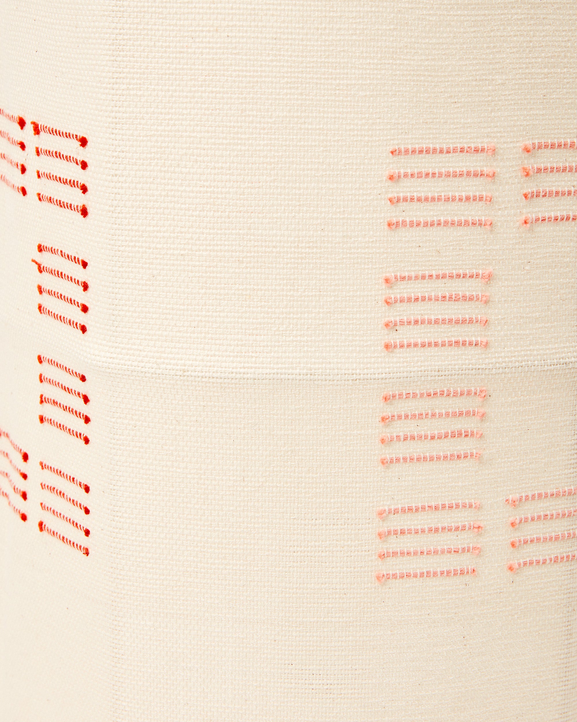 Close-up detail of ethically handwoven cotton MINNA blocks rust fabric used as a lampshade.