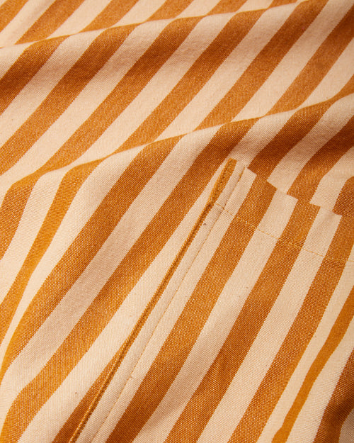 close-up detail ethically handwoven cotton fabric for MINNA Utility Apron, honey gold stripe