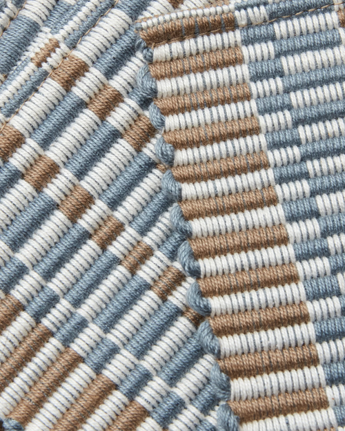close-up detail of ethically handwoven cotton coaster, texture, light blue, cream, taupe