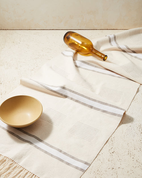 MINNA ethically handwoven cotton table runner in cream, white, and beige, neutral