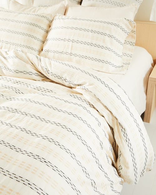 Ethically handwoven oeko-tex certified cotton bedding by MINNA in textural beige, grey, cream pattern.