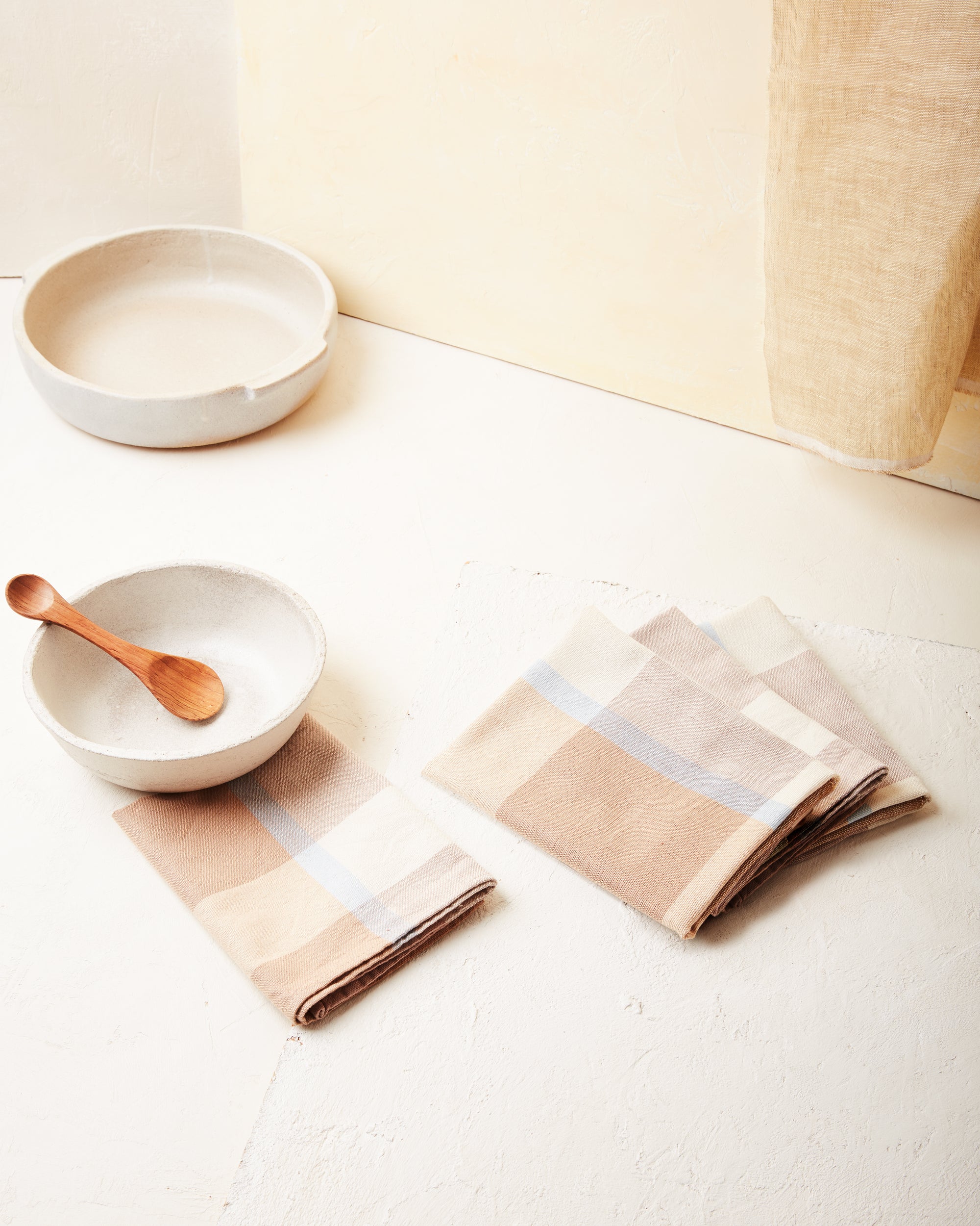 Ethically handwoven cotton napkins designed by MINNA in light brown and light blue.