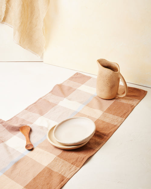 Ethically handwoven cotton table runner by MINNA, ethically handmade in light brown, sienna, and light blue.