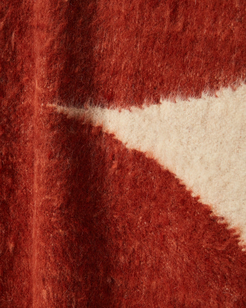 close-up detail ethically handwoven MINNA arc throw rust brushed felted wool