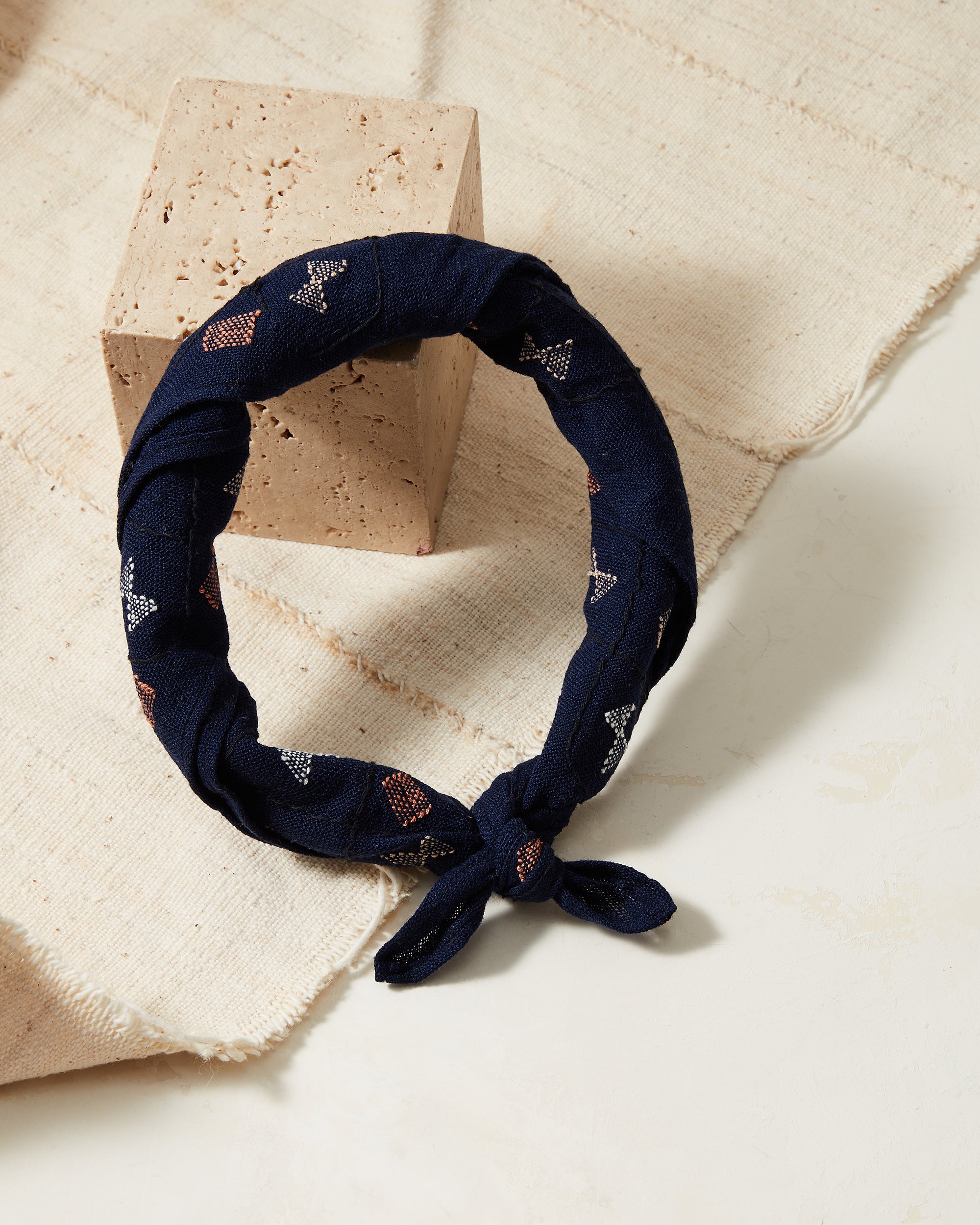 MINNA ethically backstrap handwoven bandana in indigo with cream and coral shapes