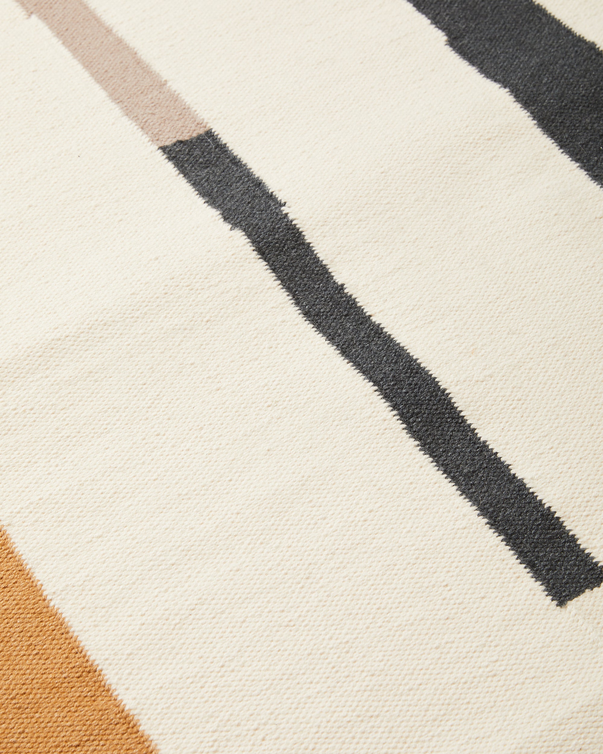 close-up of ethically handwoven flat weave MINNA Lines Rug in Oat
