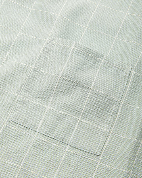 Close-up detail of handwoven ethically made Meridian Kitchen Apron by MINNA in Jay, light blue color.