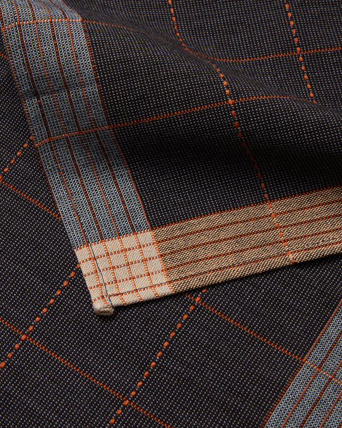 Ethically Handwoven Textile Cotton Napkin by MINNA - close-up of the dark raven napkin, black grey grid cotton napkin.