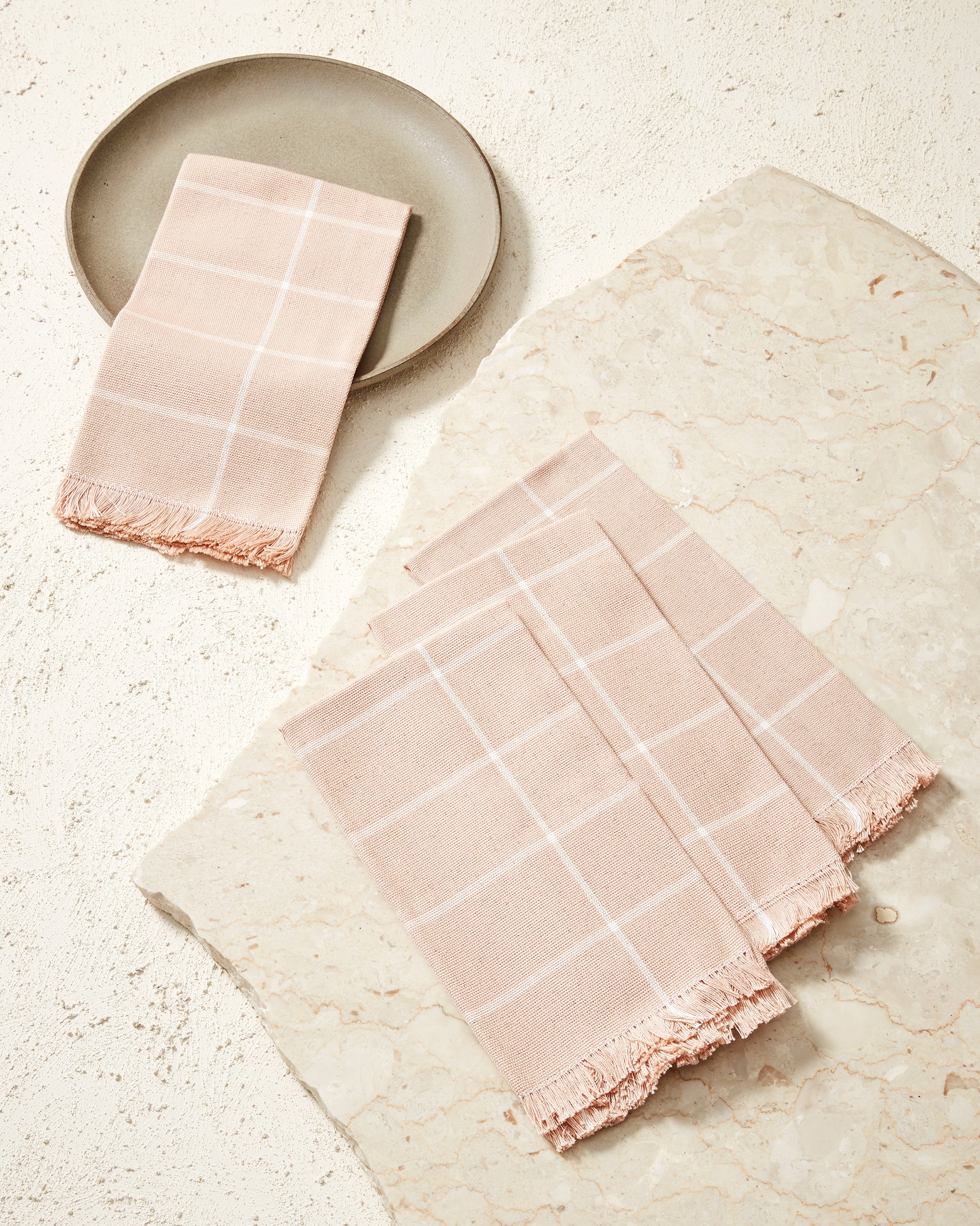 Ethically handwoven MINNA grid napkin in peach