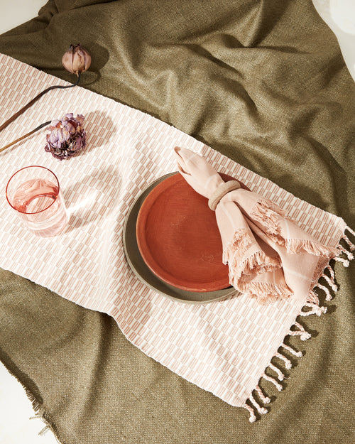 Table setting with MINNA Panalito Runner Peach and Peach Grid Napkins