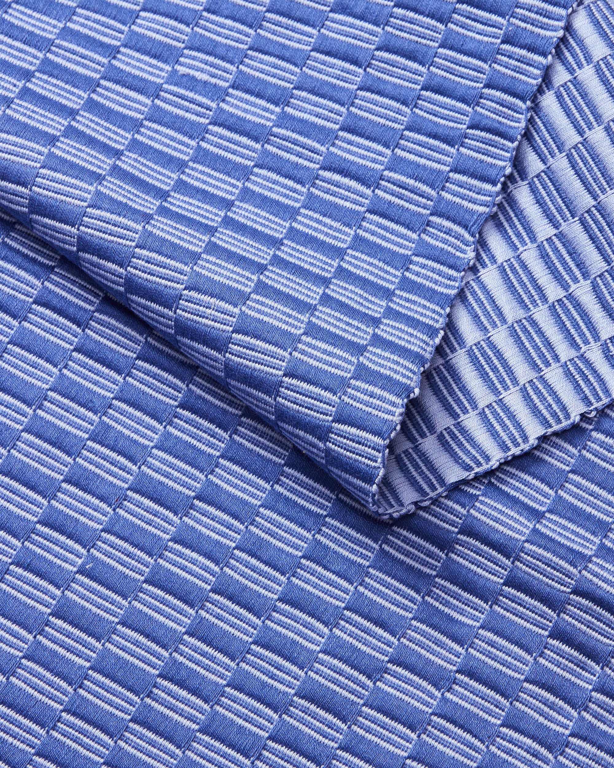 close-up detail ethically handwoven MINNA Panalito Iris blue table runner.