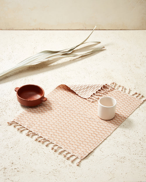 Ethically handwoven MINNA peach panalito placemat