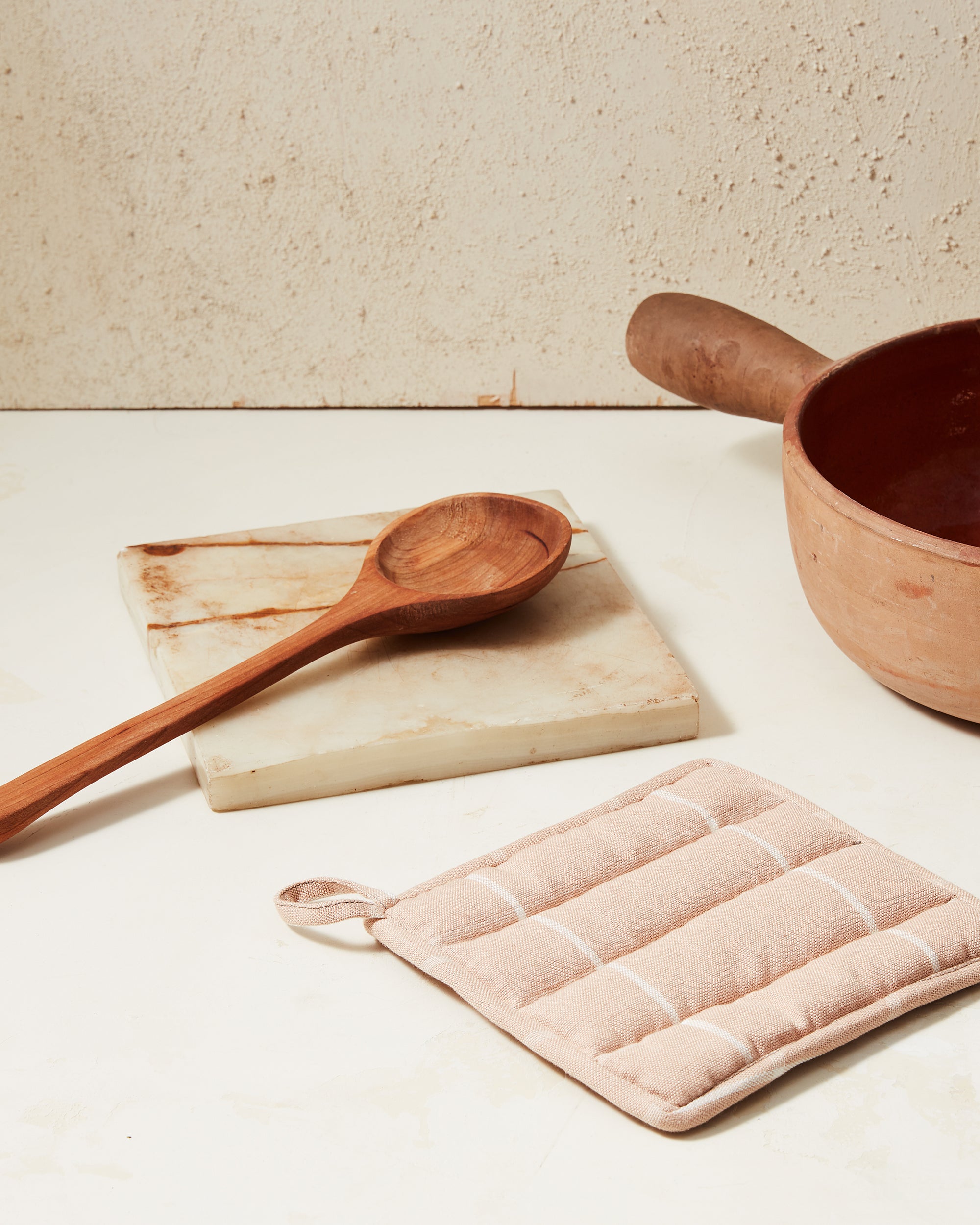 Ethically handwoven potholder with peach, pink grid pattern MINNA