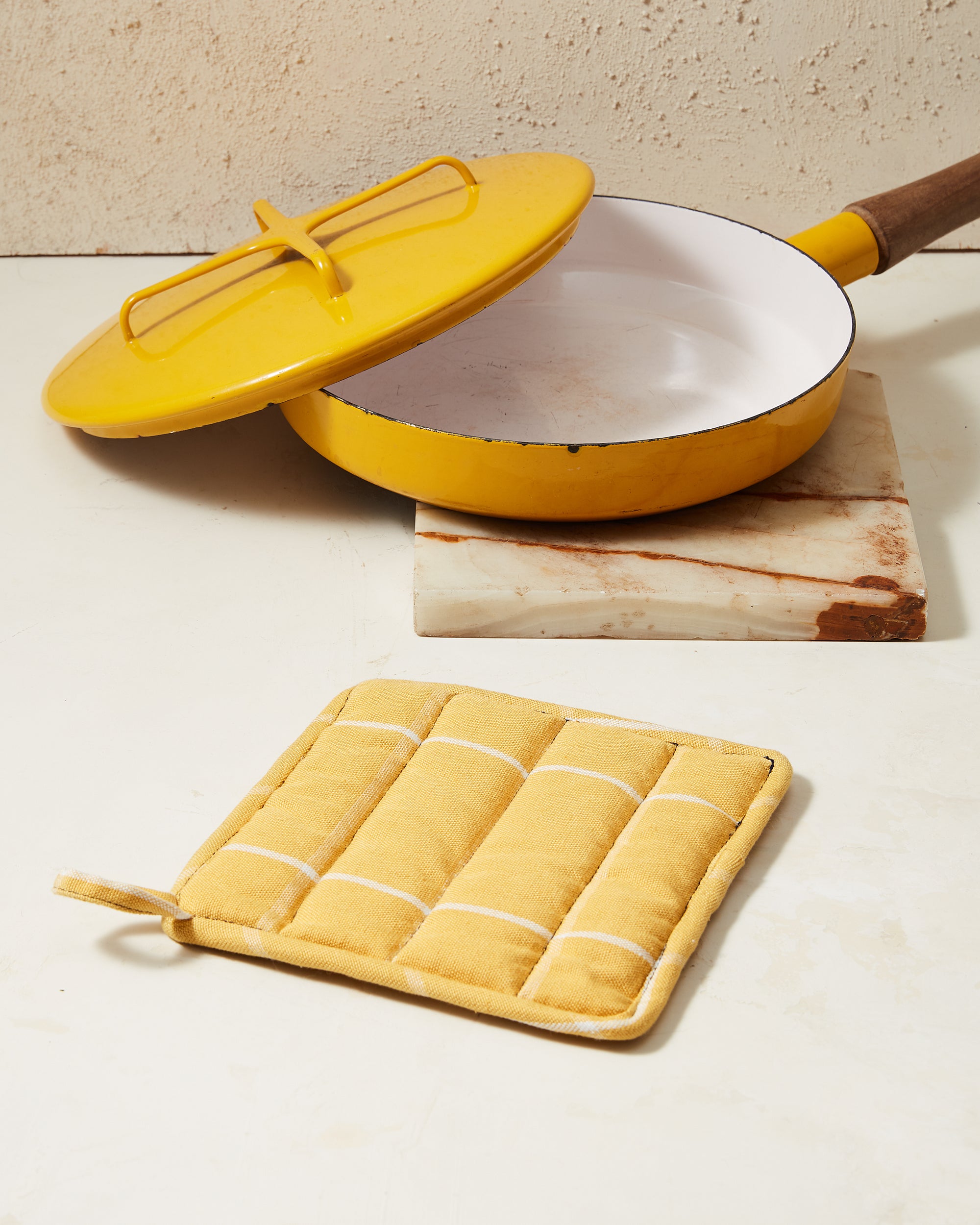 Ethically handwoven potholder with gold, yellow grid pattern MINNA