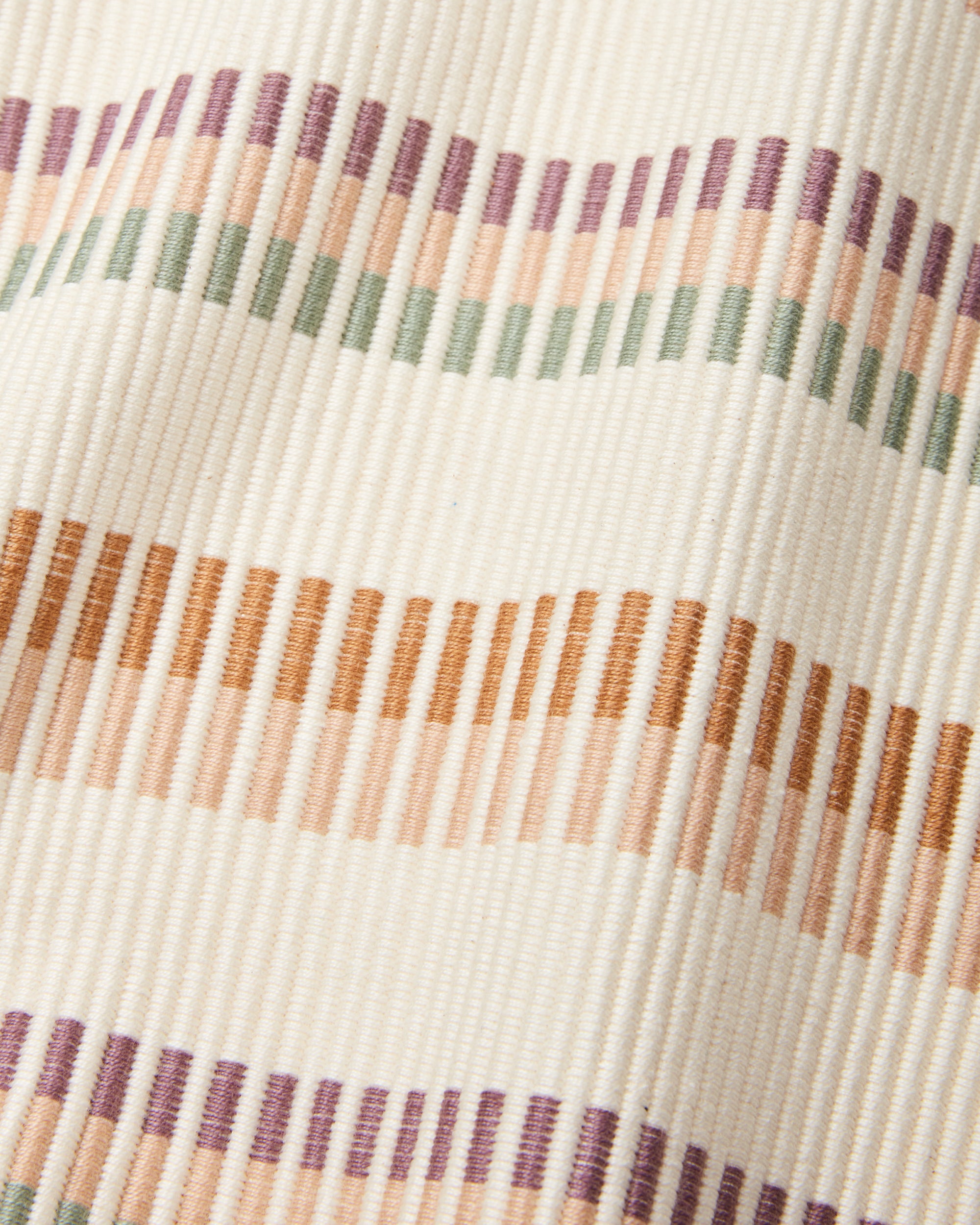 Close up of MINNA Ridges Placemat in Heron, ethically handwoven cotton placemat