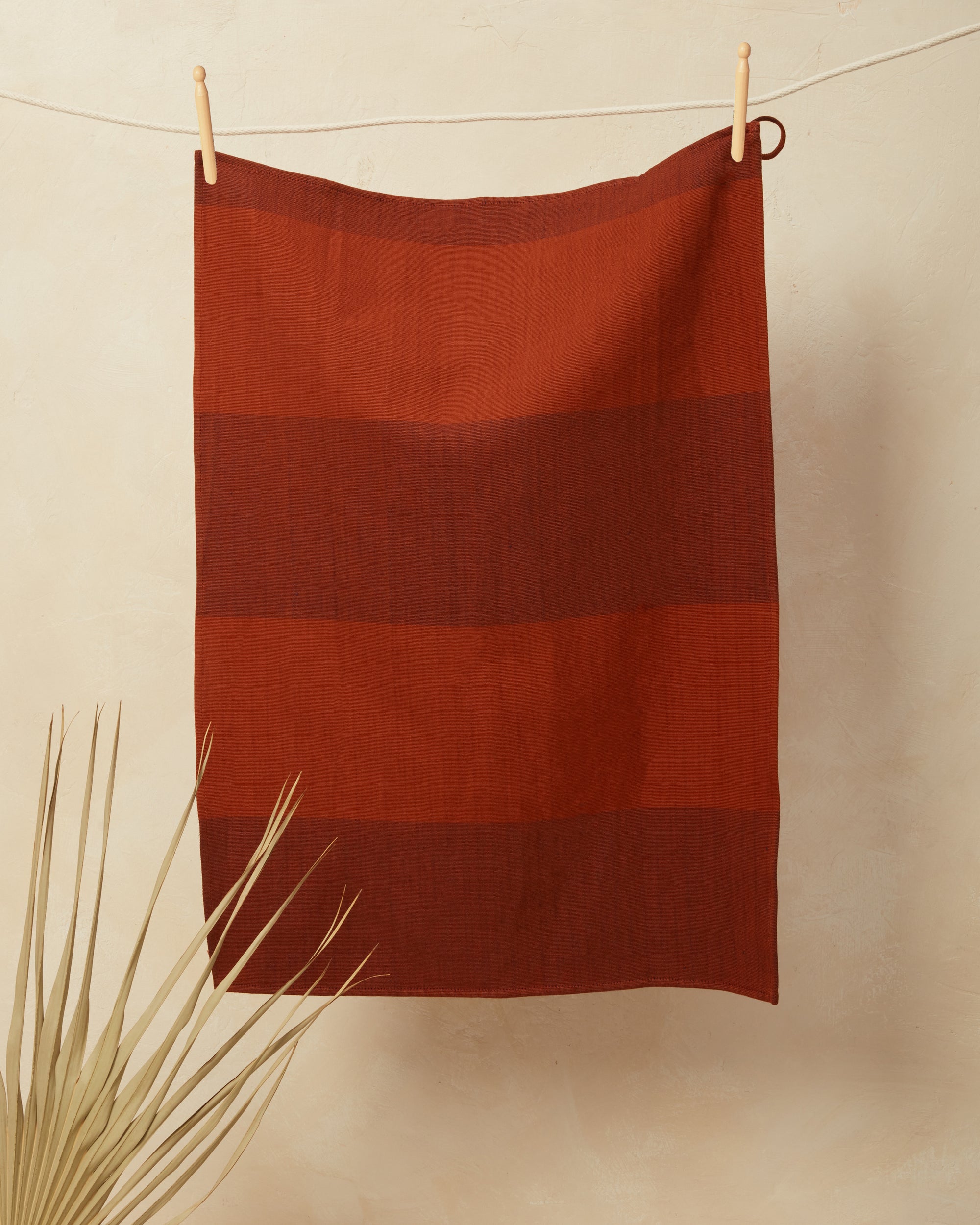 ethically handwoven cotton tea towel, hand towel, kitchen towel by MINNA in rust color.