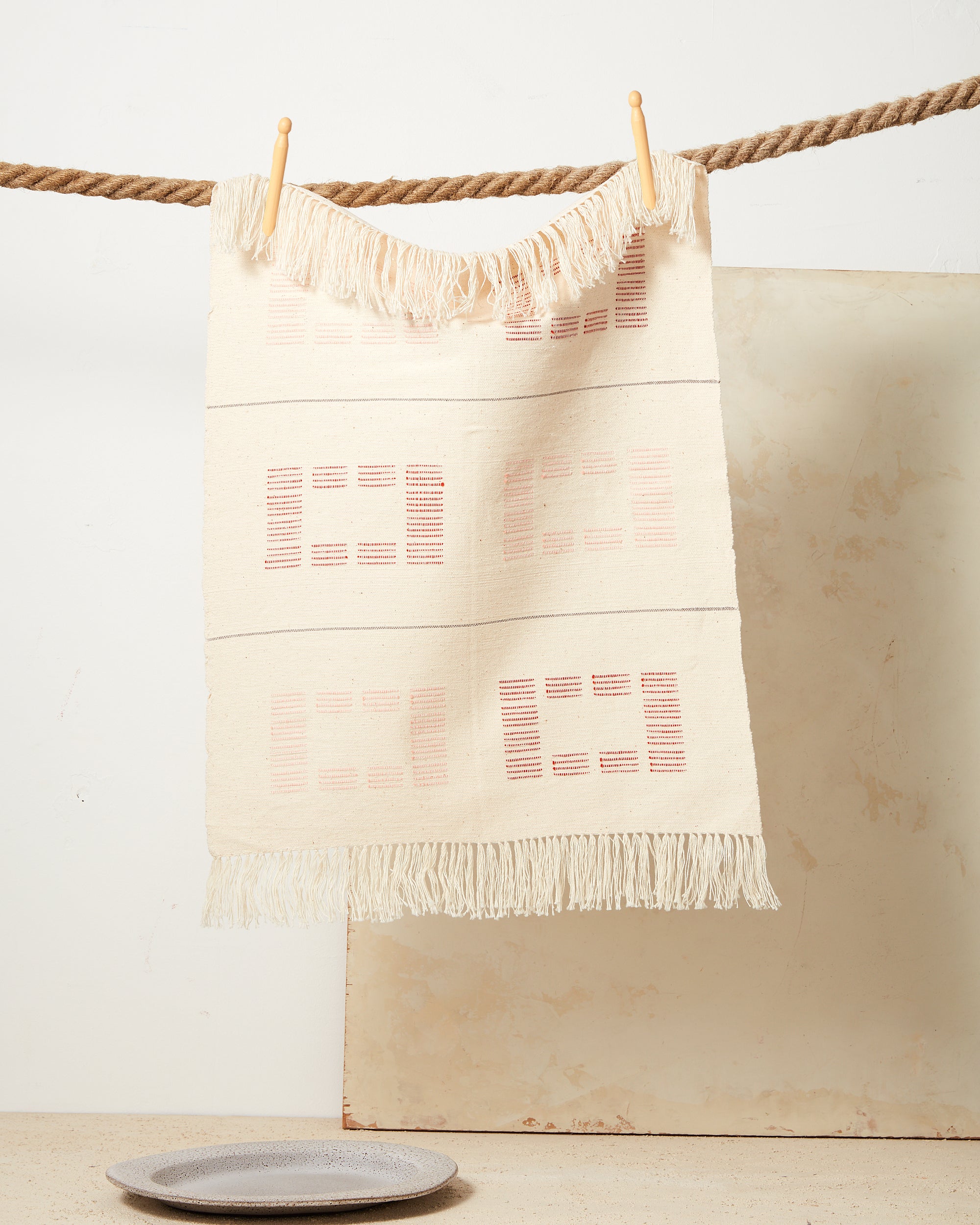 MINNA ethically handwoven tea towel 100% cotton cream with rust shapes