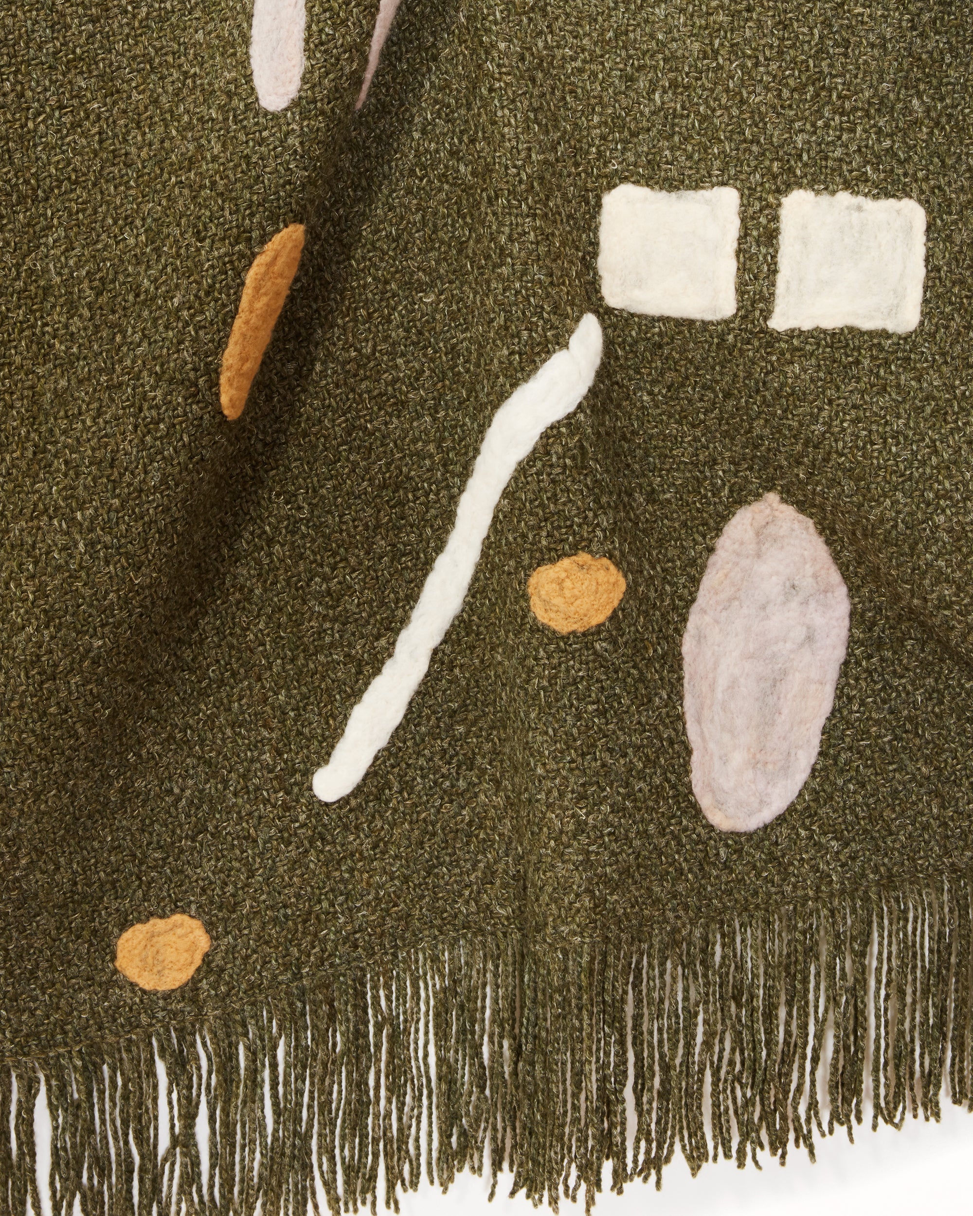 Hand woven merino wool abstract throw in hunter green MINNA