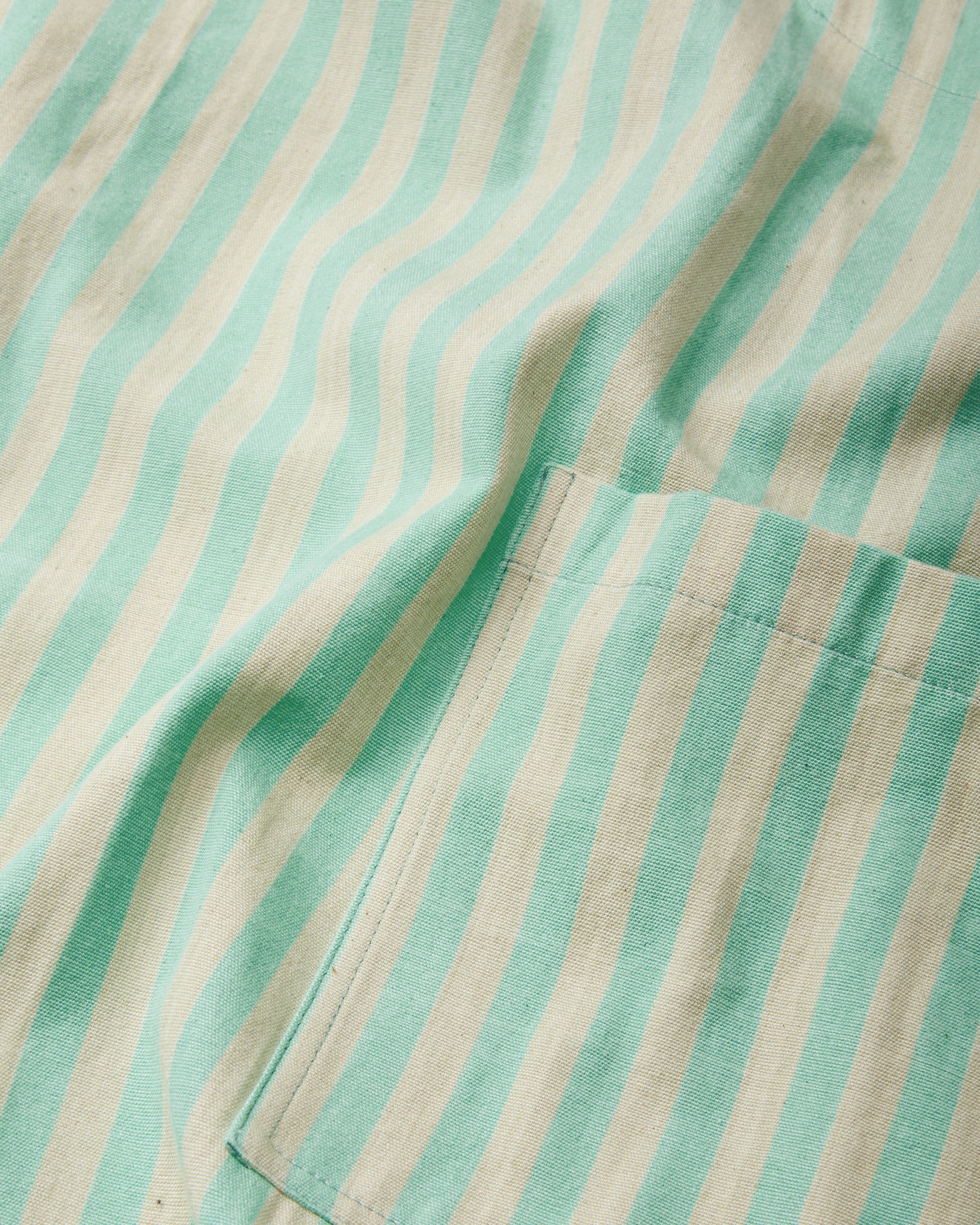 close-up detail ethically handwoven cotton fabric for MINNA Utility Apron, mint and light green stripe
