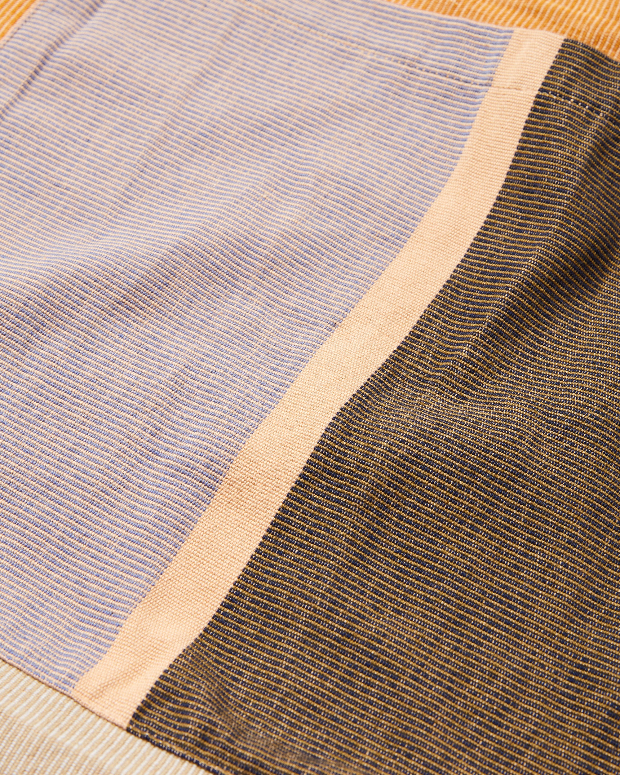 close-up detail ethically handwoven tote bag hunter green and lavender
