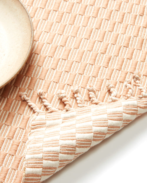 close-up detail ethically handwoven MINNA Panalito peach placemat